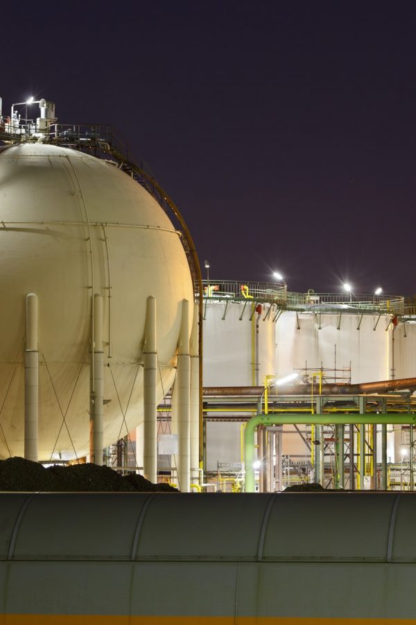Oil And Gas Storage Tanks At Night